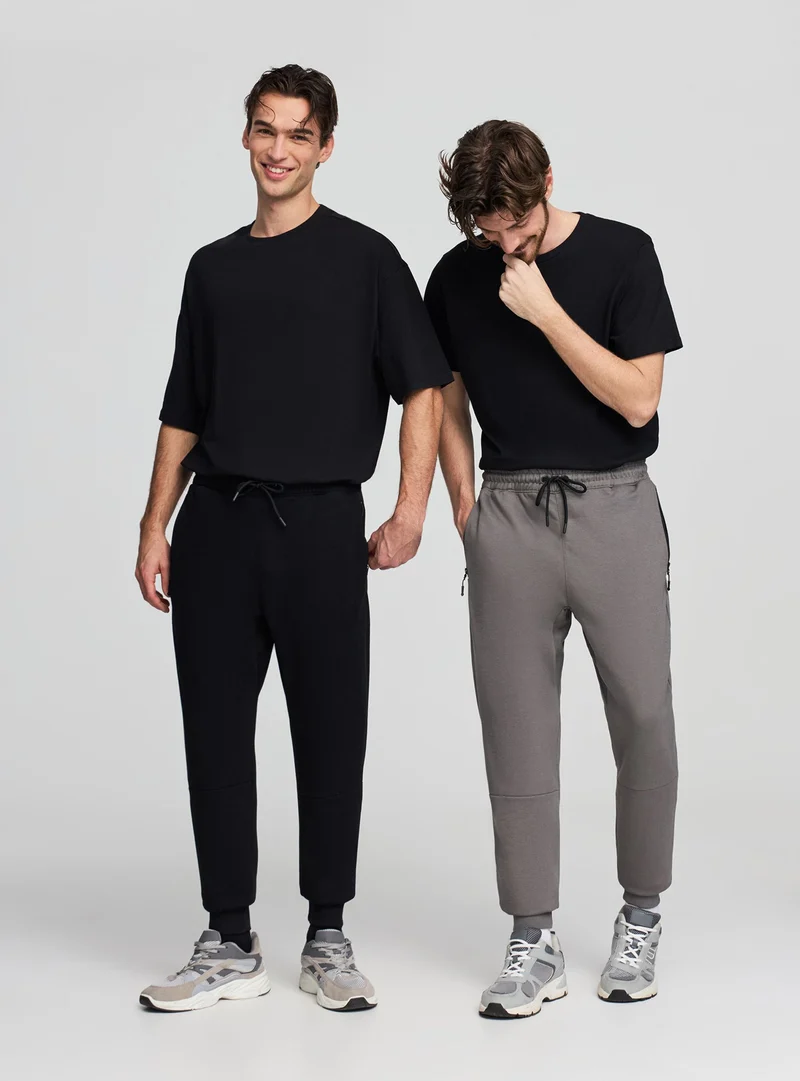 Pack 2 pantaloni tuta con zip